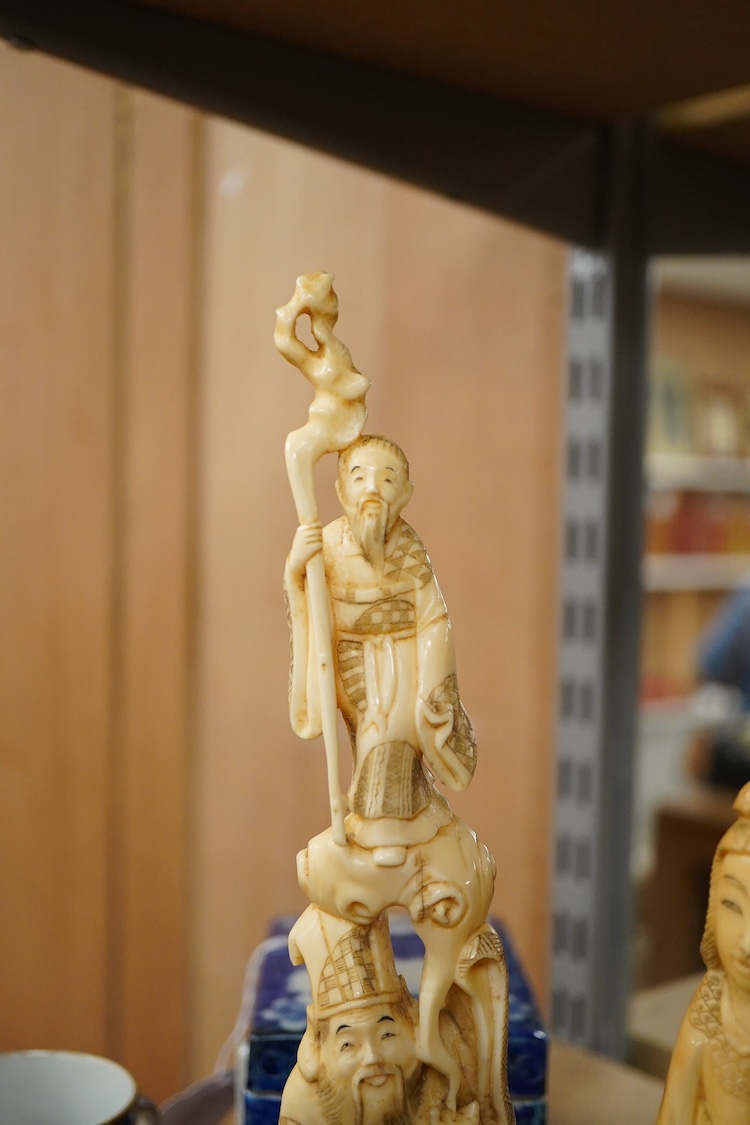 Two early 20th century Japanese walrus ivory carvings, 26cm